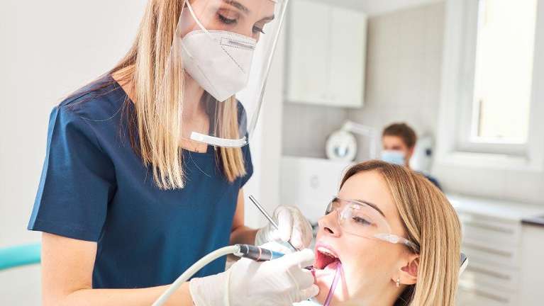 Young woman receiving emergency dental care under Covid-safe conditions | Paddington Dentistry